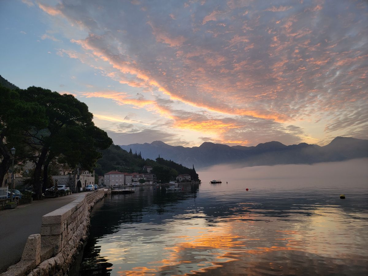 As daylight fades, Pearst basks in the warm glow of dusk—its skyline painted in hues of amber and lavender. The tranquil waters mirror the spectacle, blurring the line between earth and sky. A moment where time stands still.